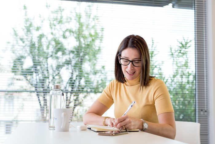 woman writting in a notebook